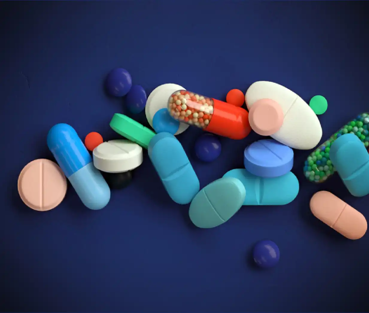 colour pill and soft gel capsule blue background